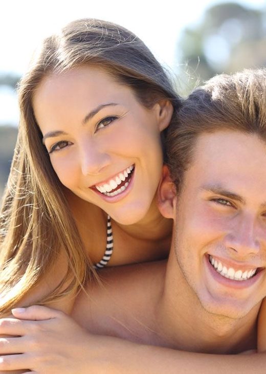 Happy Couple With Perfect Smile — Crestwood Family Dental In Molendinar, QLD