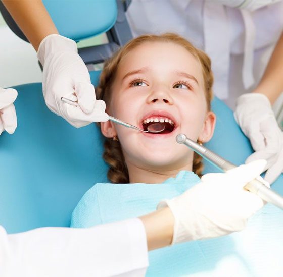 Little Girl Sitting In The Dentist Office — Crestwood Family Dental In Molendinar, QLD